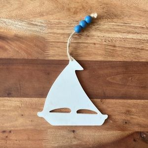 White hangable sail boat wall art